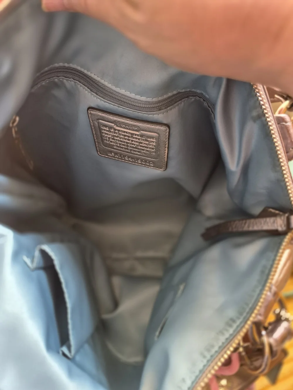 Coach sleek metallic